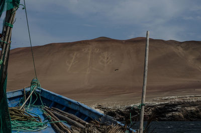 Sailboats on land against sky