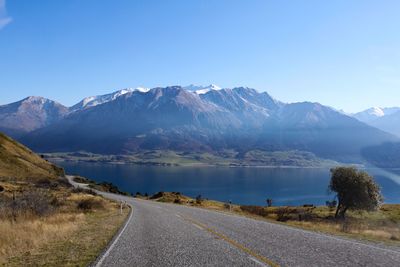 Country road leading towards mountains