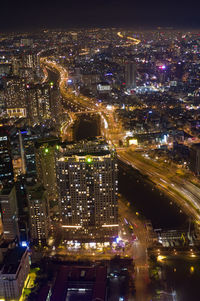 High angle view of illuminated buildings in city at night