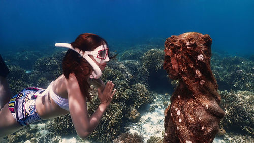 Woman swimming in sea