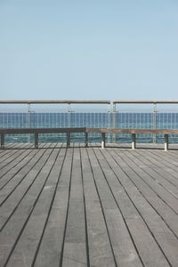 Pier over sea against clear sky