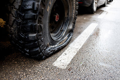 Low section of a high angle view of cars on road