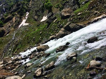 Scenic view of stream flowing through rocks