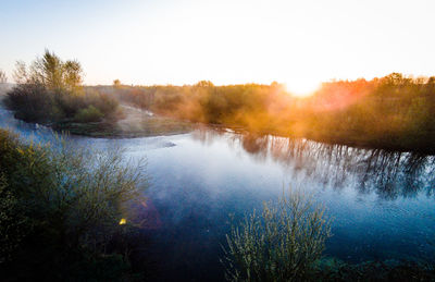 Scenic view of river against clear sky