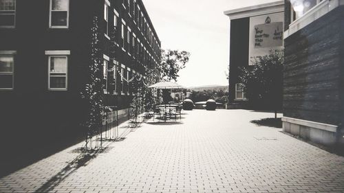 Empty alley along buildings