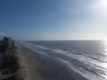 Scenic view of beach against clear sky