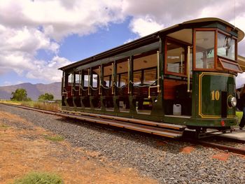 Train on railroad track against sky