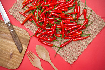 High angle view of red chili peppers on table