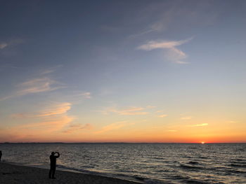 Scenic view of sunset over sea