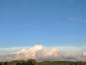 Scenic view of landscape against blue sky