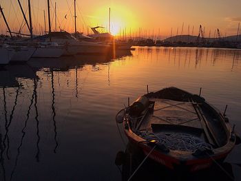 Boats moored at sunset