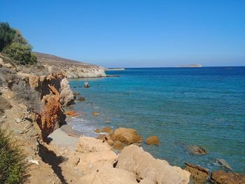 Scenic view of sea against clear blue sky