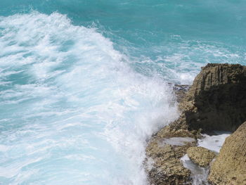 Waves splashing on rocks