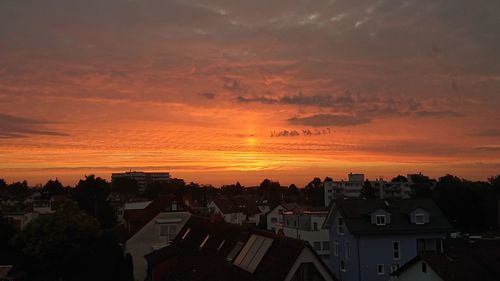 High angle view of buildings against sky during sunset