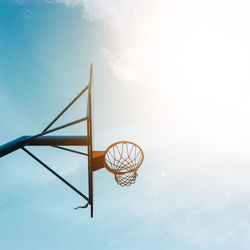 Street basketball hoop and blue sky