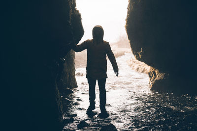 Full length of man standing in cave