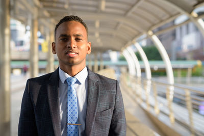 Portrait of young man standing outdoors