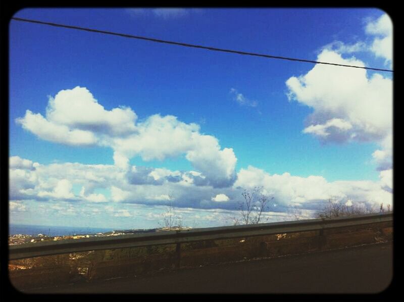 transfer print, sky, auto post production filter, power line, electricity pylon, transportation, cloud - sky, connection, cloud, power supply, electricity, fuel and power generation, road, landscape, cloudy, railroad track, day, field, outdoors, no people