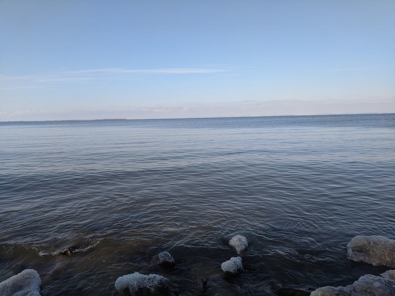 water, sea, sky, shore, ocean, beauty in nature, horizon, scenics - nature, coast, nature, body of water, tranquility, tranquil scene, rock, beach, land, horizon over water, day, no people, outdoors, idyllic, non-urban scene, reflection, clear sky, blue, wave, cloud, environment, bay, ice