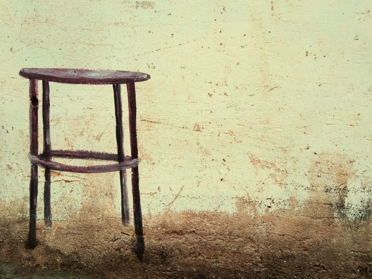 ABANDONED CHAIR AGAINST WALL