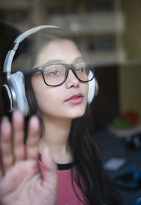 Close-up of young woman wearing sunglasses