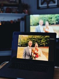 Portrait of friends sitting on table