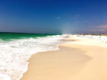 View of beach against blue sky