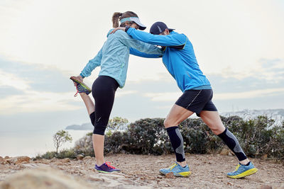 Couple doing warm up exercise together