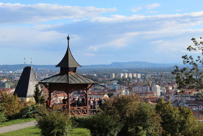 High angle view of trees and buildings against sky