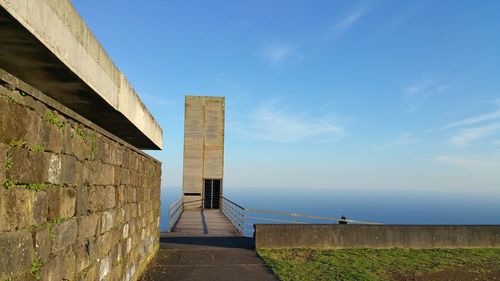 View of wall by sea against sky