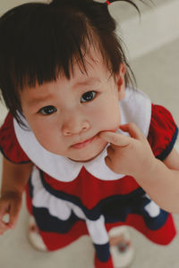 Portrait of cute baby girl at home