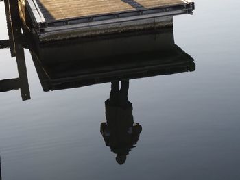 High angle view of old wooden structure in lake