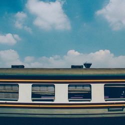 Train on road against sky