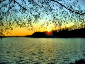 Scenic view of lake against sky during sunset