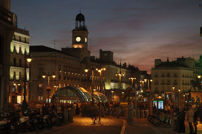Illuminated puerta del sol against sky