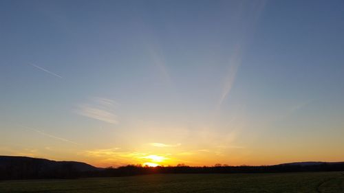 Scenic view of landscape at sunset