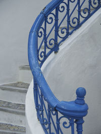 High angle view of text on railing against wall