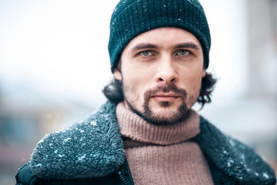 Portrait of young man wearing hat during winter