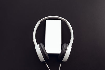 Close-up of telephone booth against black background