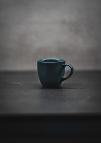 Close-up of coffee cup on table