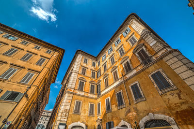 Low angle view of building against blue sky