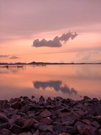 Scenic view of sea against sky at sunset