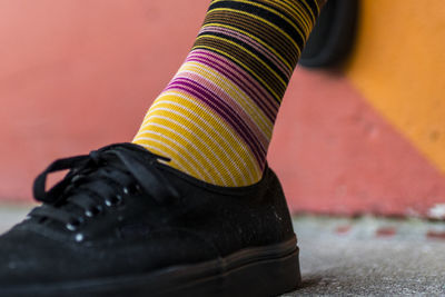 Low section of woman wearing shoes