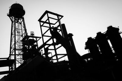 Low angle view of silhouette man against sky