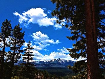 Scenic view of mountains against cloudy sky