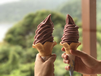 Close-up of hand holding ice cream