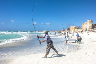 Man fishing on beach