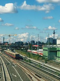 High angle view of railroad tracks against cloudy sky