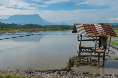 Abandoned built structure on agricultural field