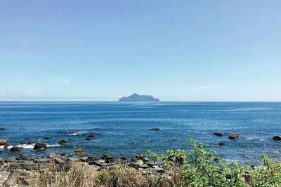 Scenic view of sea against clear sky